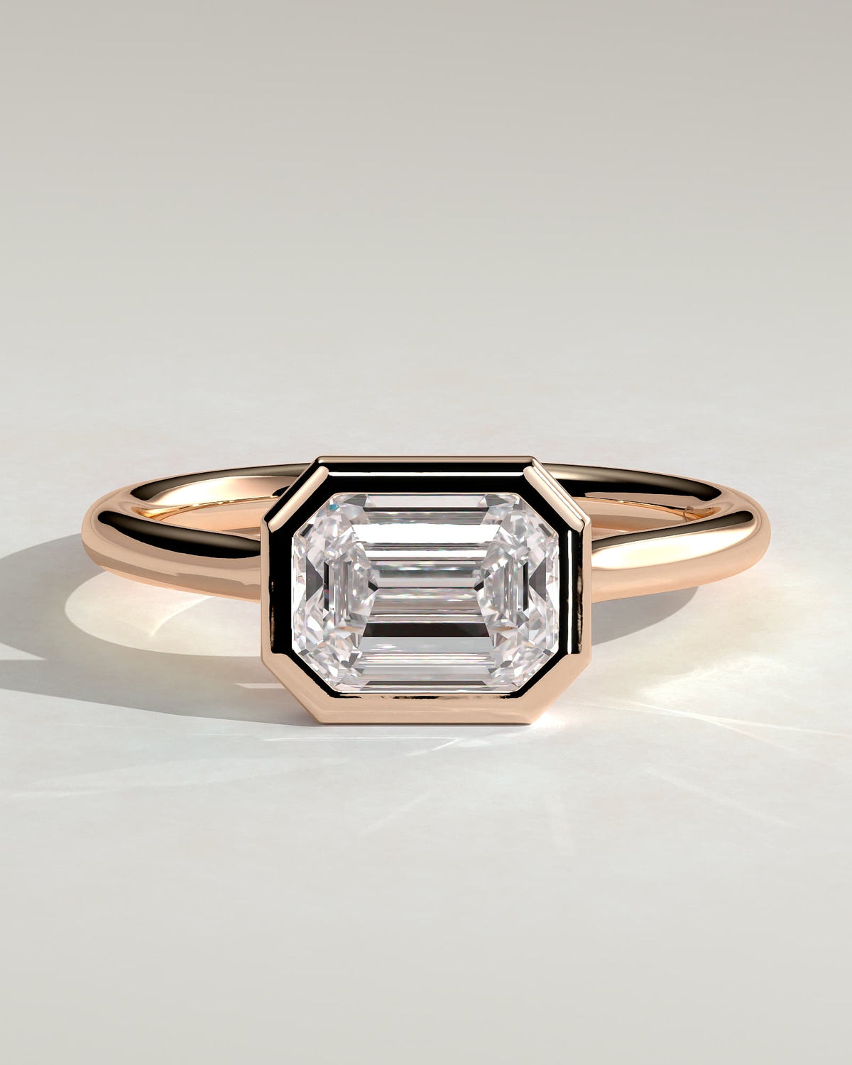 Olive - Statement Emerald East West Bezel Solitaire with Open Cathedral High Setting Engagement Ring - Rose Gold