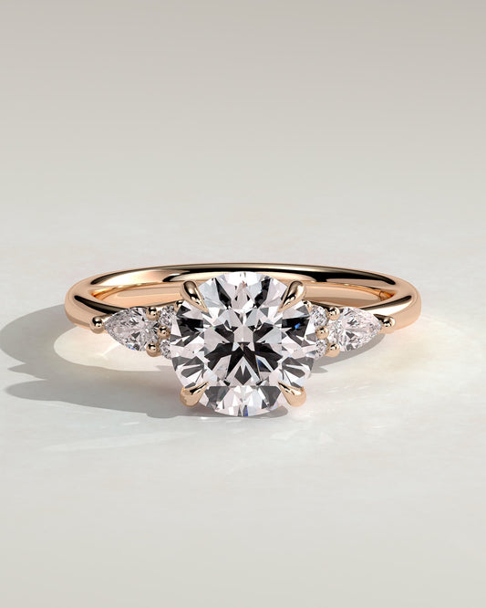 Maggie - Round Claw Solitaire with Pear Accents and Round Shoulder Stones Engagement Ring - Rose Gold