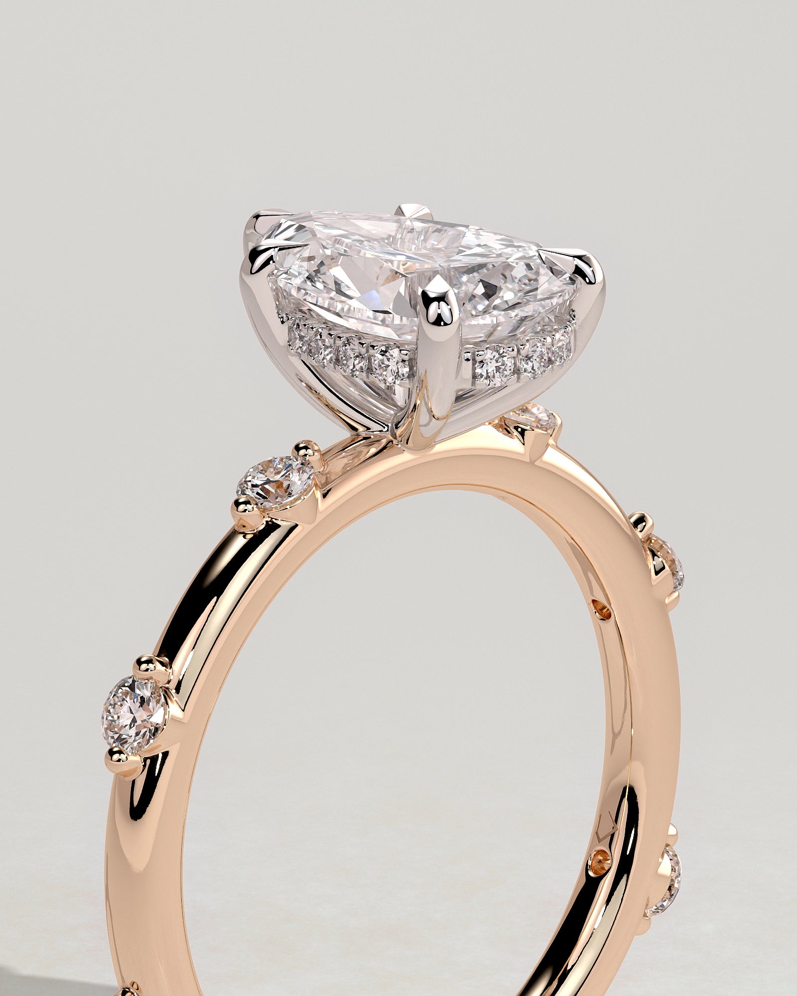 Amora - Pear Claw Solitaire with 6 Spaced Round Accent Stones and Hidden Halo Engagement Ring - Rose Two-Tone - Rose Two-Tone 2ct
