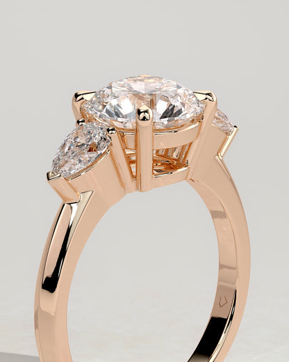 Halle - Round Claw Trilogy with Pear Side Stones and Knife Edge Band Engagement Ring - Rose Gold