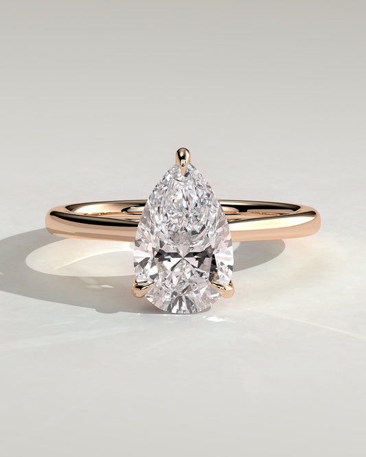 Courtney - Pear Claw Solitaire with Hidden Halo, Tapered Band and Cathedral High Setting Engagement Ring - Rose Gold