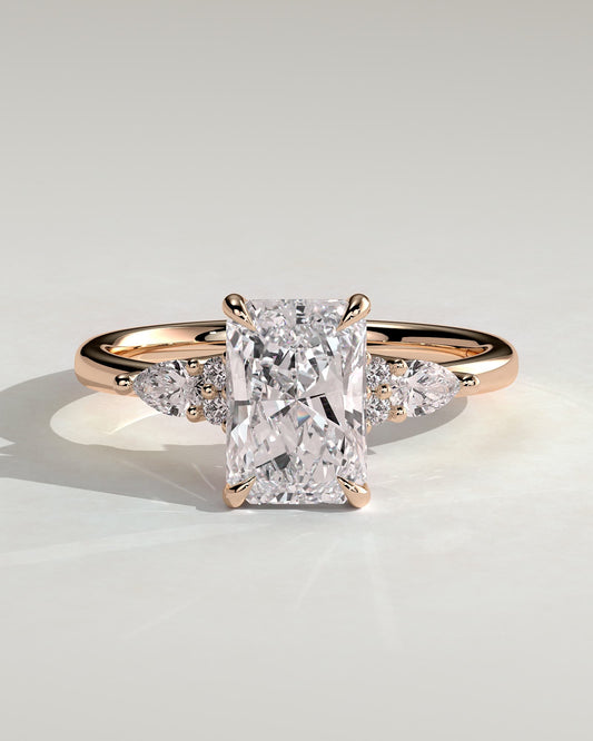 Heidi - Radiant Claw Solitaire with Pear Accents and Round Shoulder Stones Engagement Ring - Rose Gold