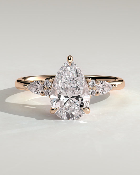 Lindsay - Pear Claw Solitaire with Pear Accents and Round Shoulder Stones Engagement Ring - Rose Gold