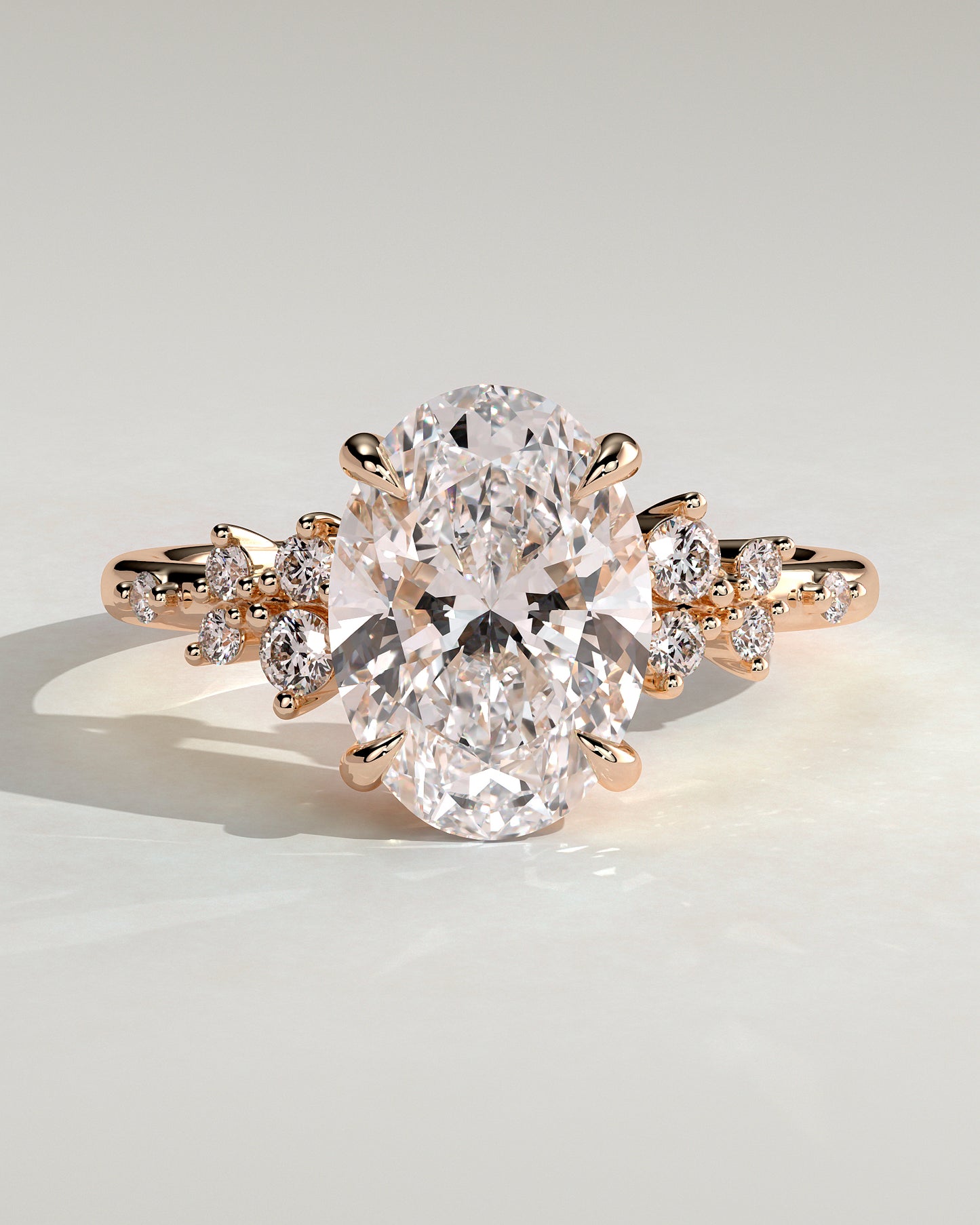 Bella - Oval Claw Solitaire with Clustered Round Shoulder Stones Engagement Ring - Rose Gold