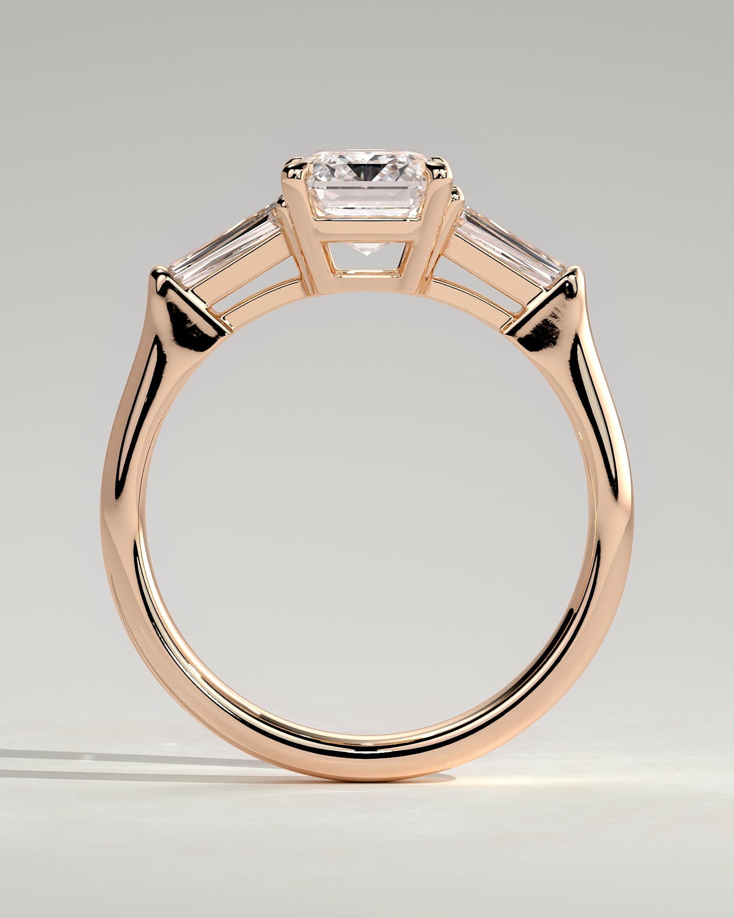 Bridget - Emerald Claw Trilogy with Tapered Baguette Side Stones and Cathedral Setting Engagement Ring - Rose Gold