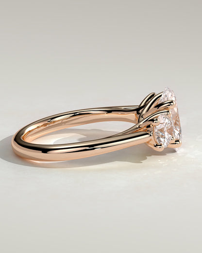 Grace - Oval Claw Trilogy with Round Side Stones, Open Trellis Gallery and Tapered Band Engagement Ring - Rose Gold