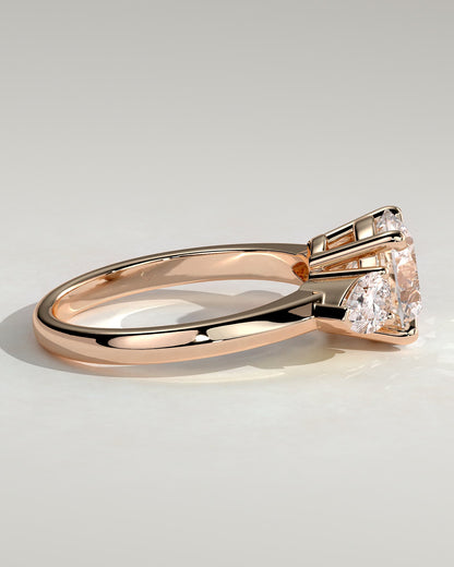 Halle - Round Claw Trilogy with Pear Side Stones and Knife Edge Band Engagement Ring - Rose Gold