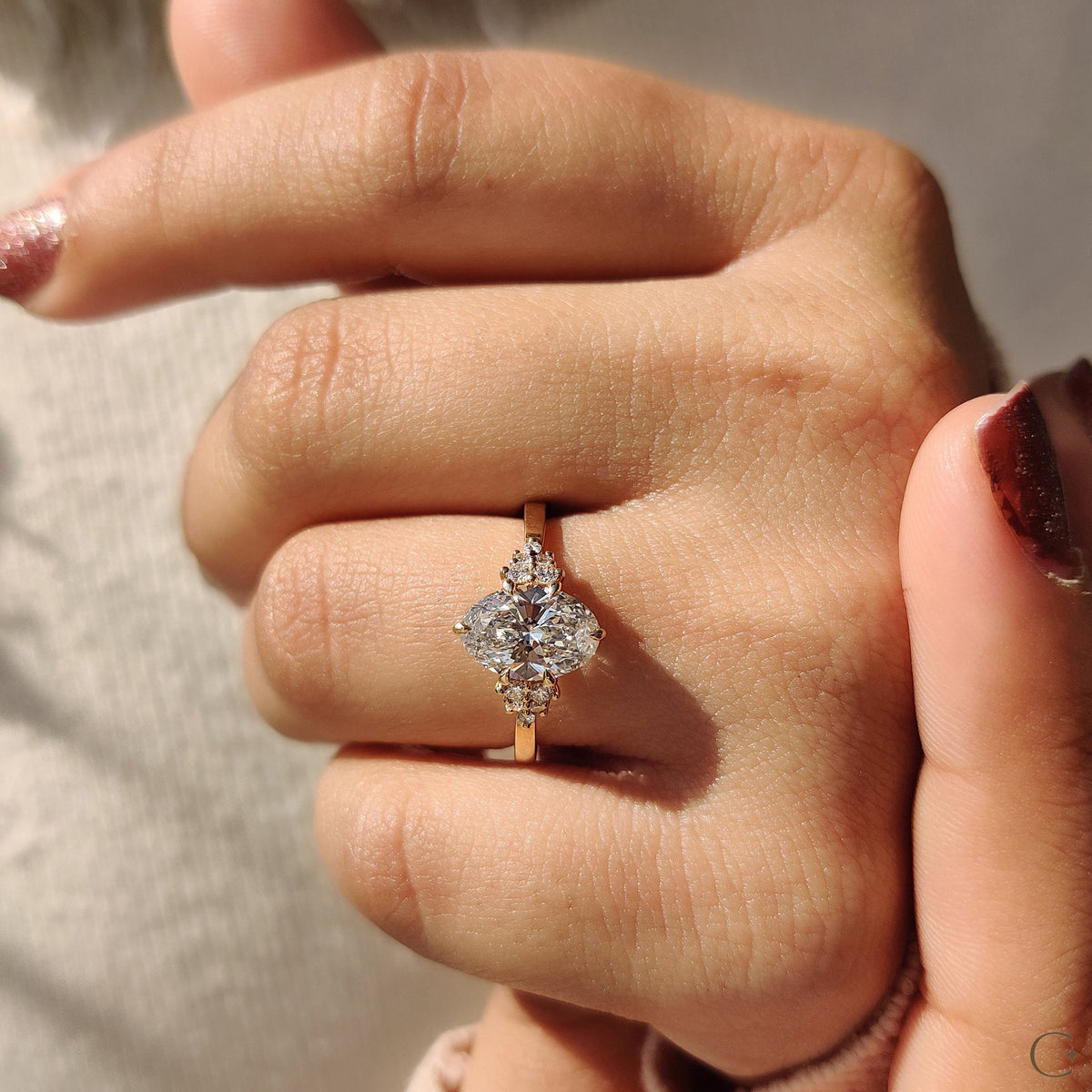 Oval Diamond Ring With Round Cut Side Stone