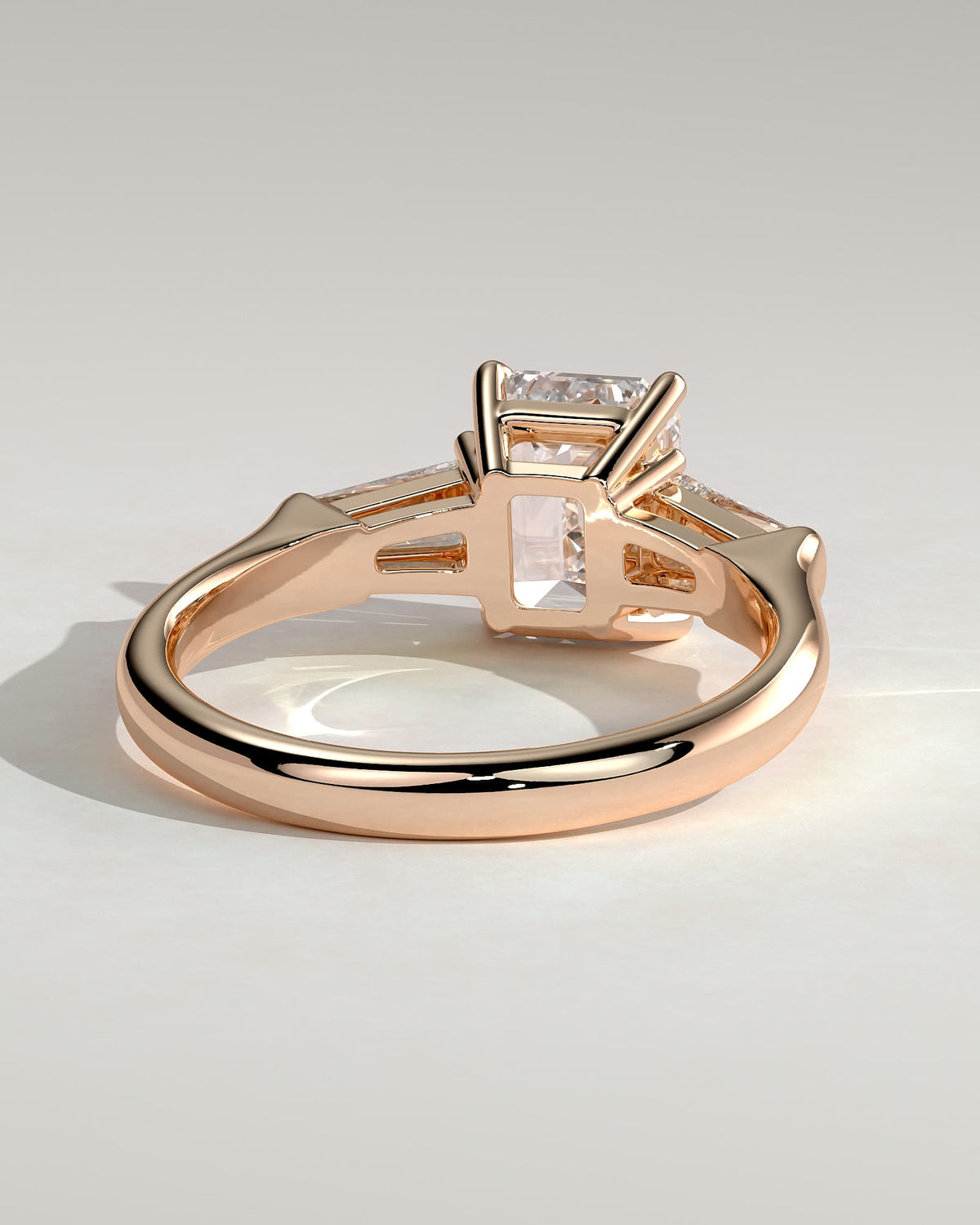 Bridget - Emerald Claw Trilogy with Tapered Baguette Side Stones and Cathedral Setting Engagement Ring - Rose Gold