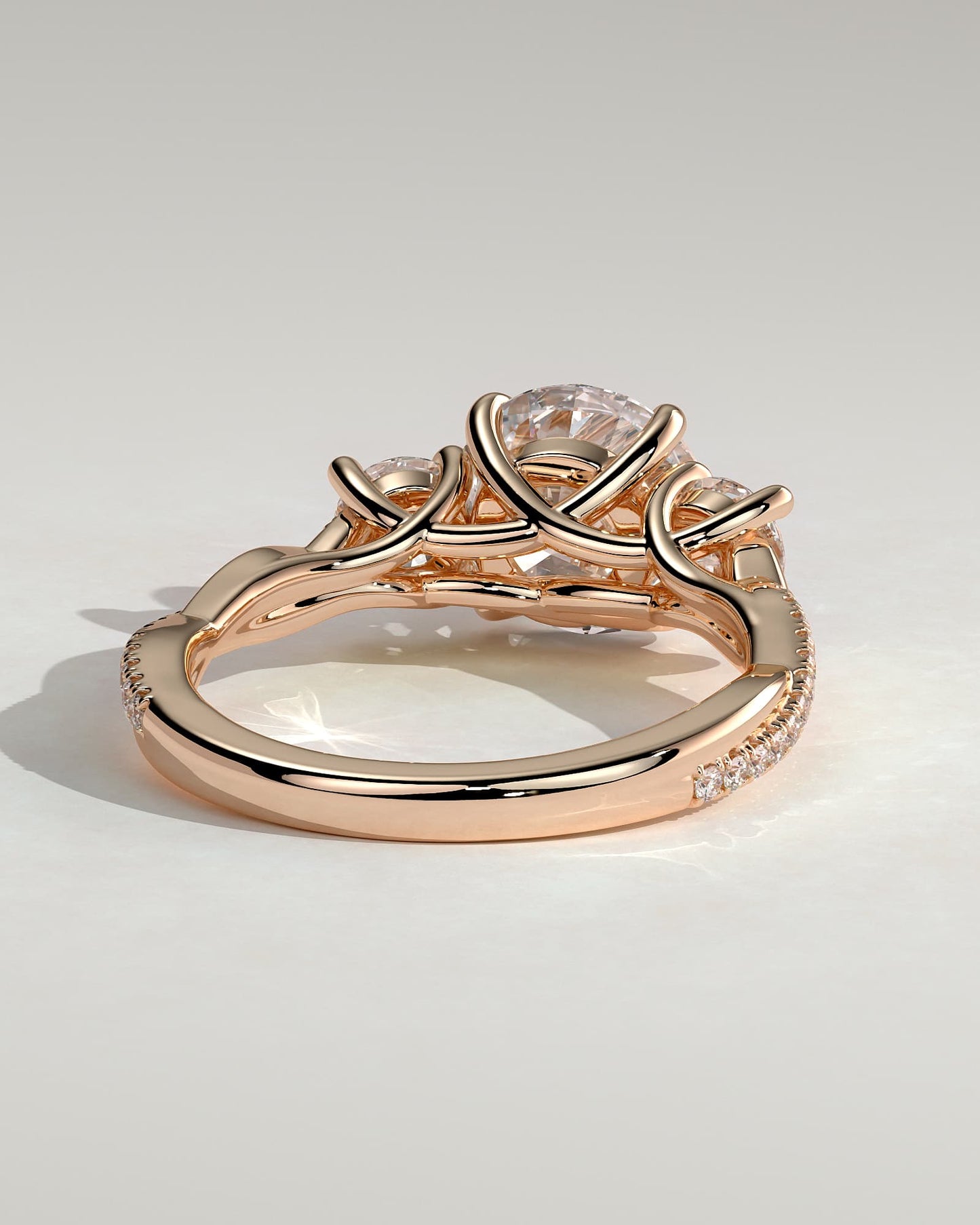 Jaylene - Round Claw Trilogy with Round Side Stones, Twisted Pave Band and Trellis Gallery Engagement Ring - Rose Gold