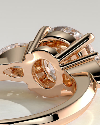 Halle - Round Claw Trilogy with Pear Side Stones and Knife Edge Band Engagement Ring - Rose Gold