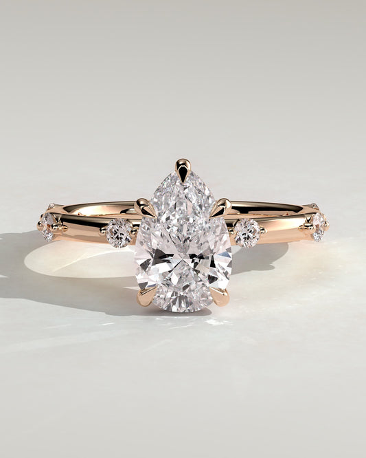 Amora - Pear Claw Solitaire with 6 Spaced Round Accent Stones and Hidden Halo Engagement Ring - Rose Gold