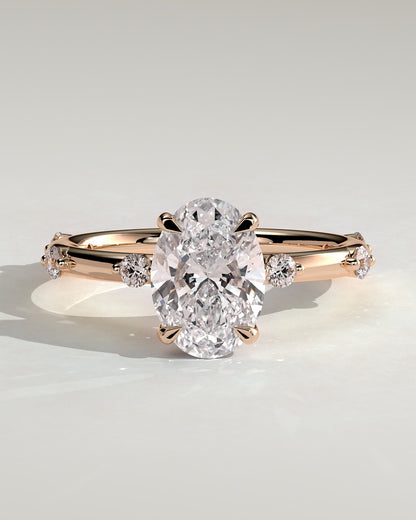 Elise - Oval Claw Solitaire with 6 Spaced Round Accent Stones and Hidden Halo Engagement Ring - Rose Gold