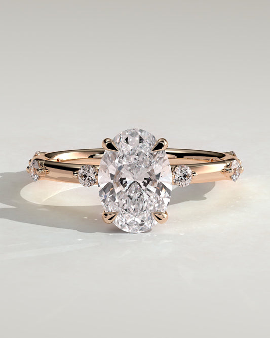 Elise - Oval Claw Solitaire with 6 Spaced Round Accent Stones and Hidden Halo Engagement Ring - Rose Gold