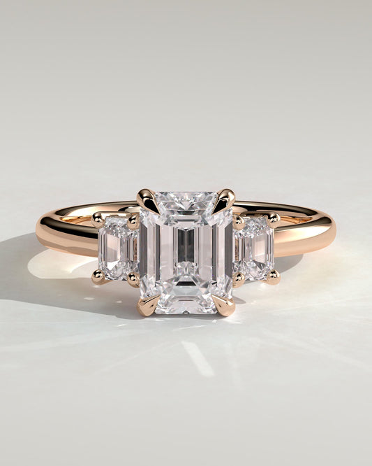 Silvana - Emerald Claw Trilogy with Emerald Side Stones and Low Setting Engagement Ring - Rose Gold