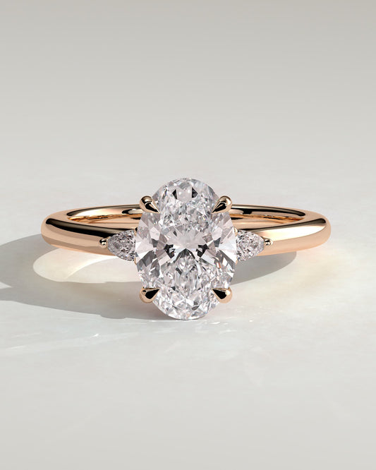 Elena - Oval Claw Trilogy with Pear Side Stones and Tulip Detail Engagement Ring - Rose Gold
