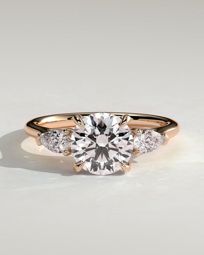 Arya - Round Claw Trilogy with Pear Side Stones and Cathedral Setting Engagement Ring - Rose Gold