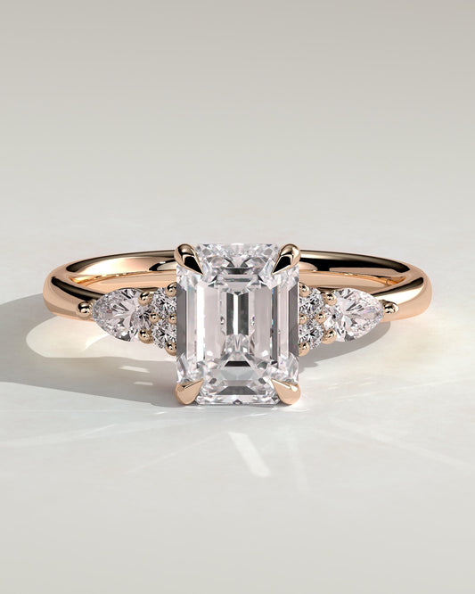 Raleigh - Emerald Claw Solitaire with Pear Accents and Round Shoulder Stones Engagement Ring - Rose Gold