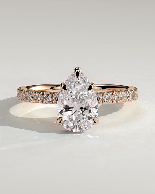 Jordanna - Pear Claw Solitaire with Wrap Around Hidden Halo and Pave Band Engagement Ring - Rose Gold