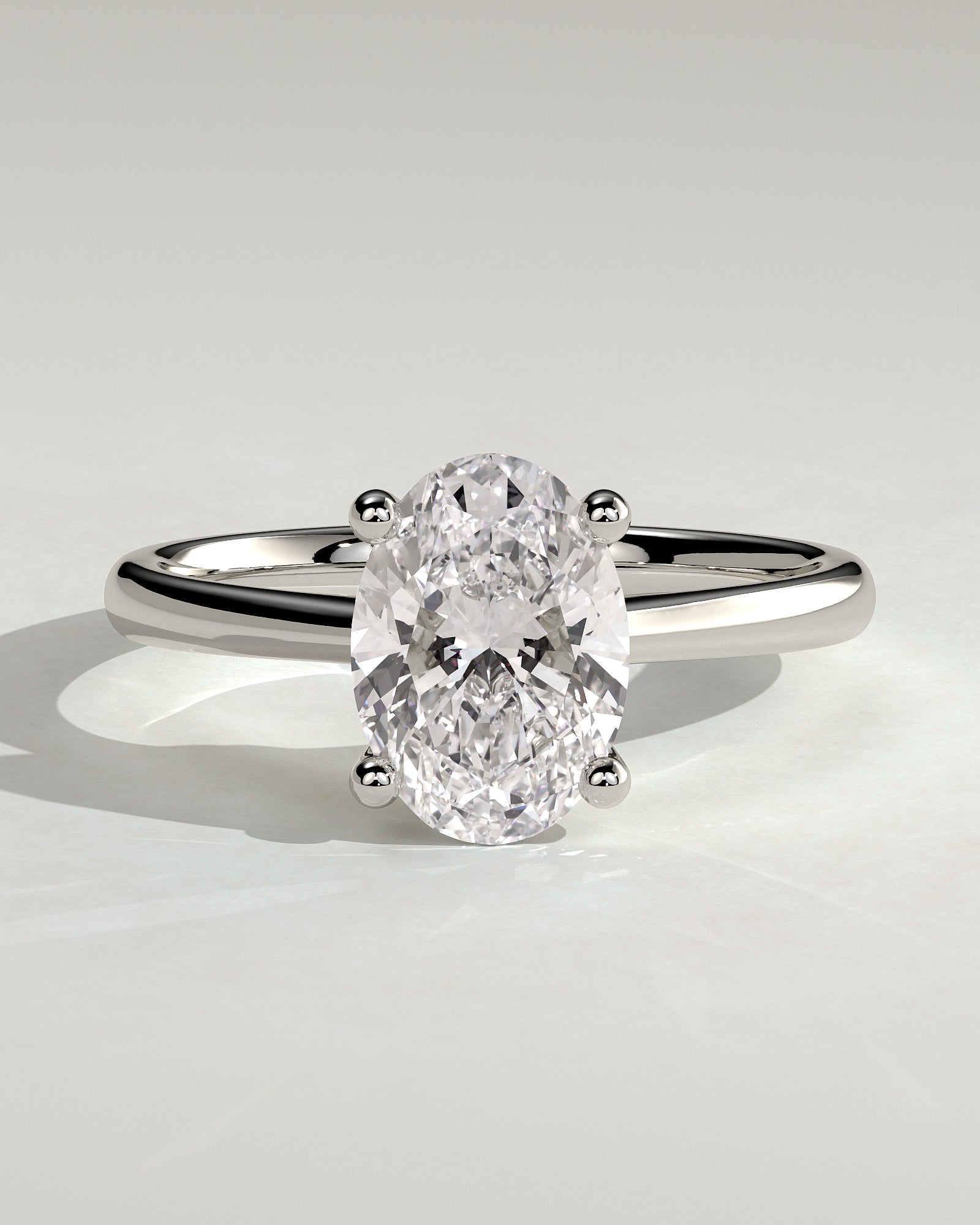 Emily - Oval Claw Solitaire with Pinched Tapered Band and Cathedral Low Setting Engagement Ring - Platinum - White Gold / Platinum 2ct