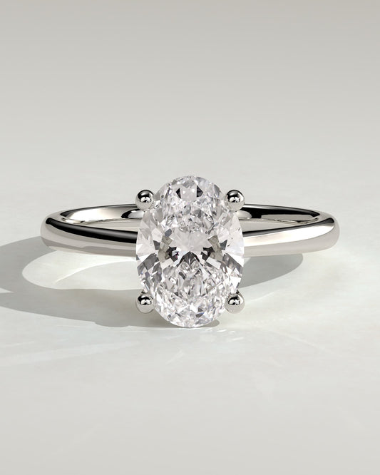 Emily - Oval Claw Solitaire with Pinched Tapered Band and Cathedral Low Setting Engagement Ring - White Gold