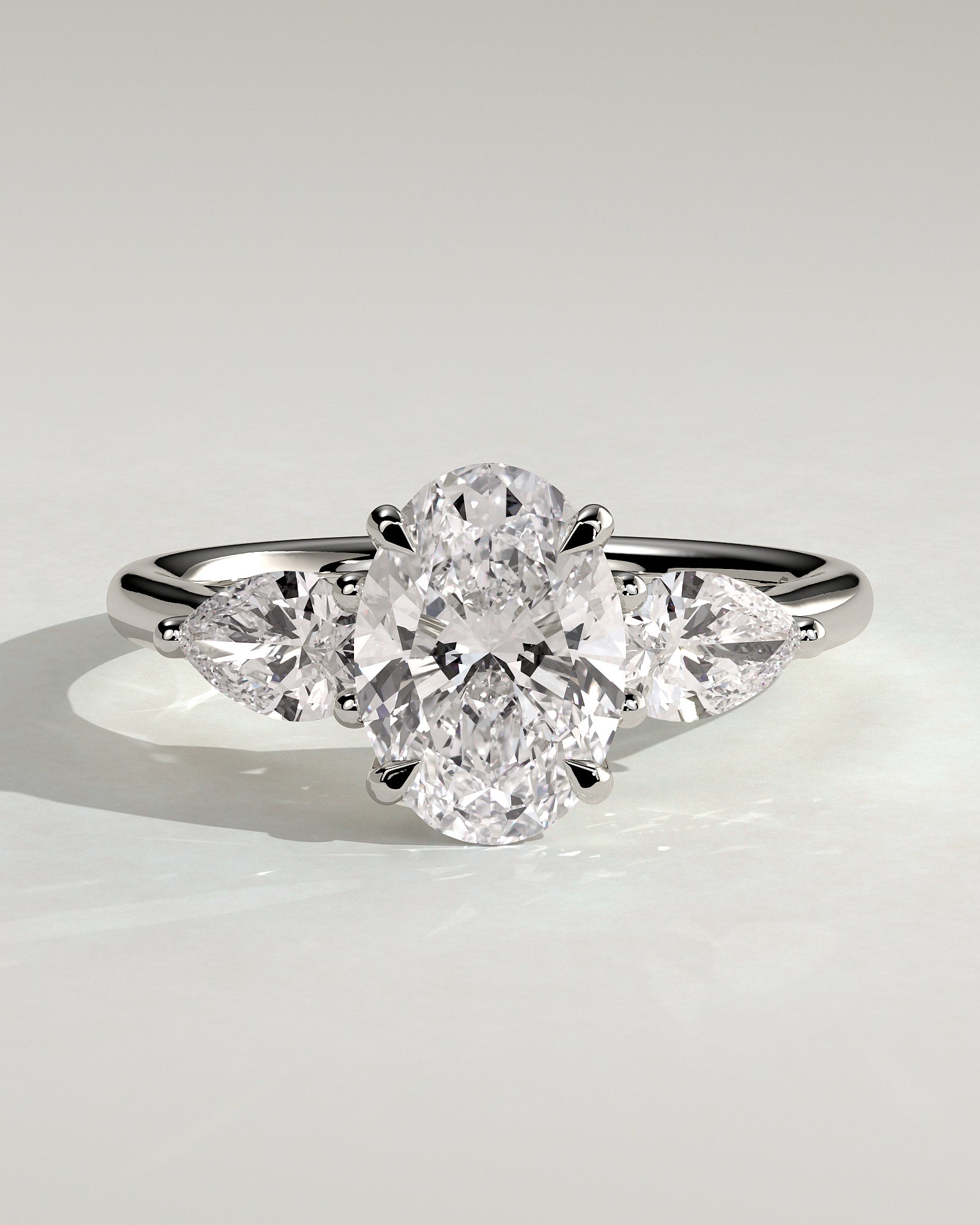 Amara - Oval Claw Trilogy with Pear Side Stones and Open Trellis Gallery Engagement Ring - Platinum - White Gold / Platinum 2ct