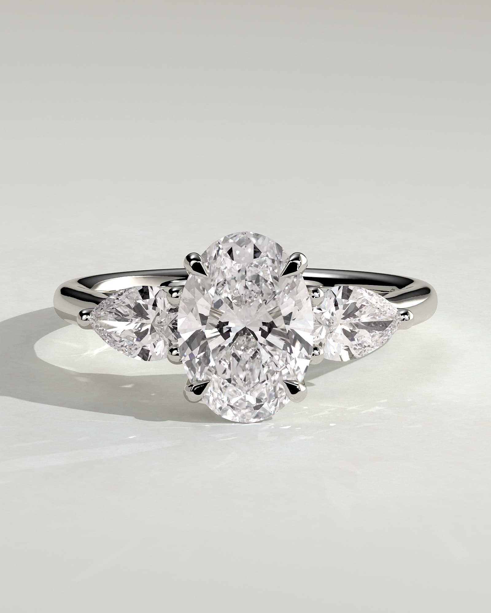 Amara - Oval Claw Trilogy with Pear Side Stones and Open Trellis Gallery Engagement Ring - White Gold - white gold - Lara Jewels