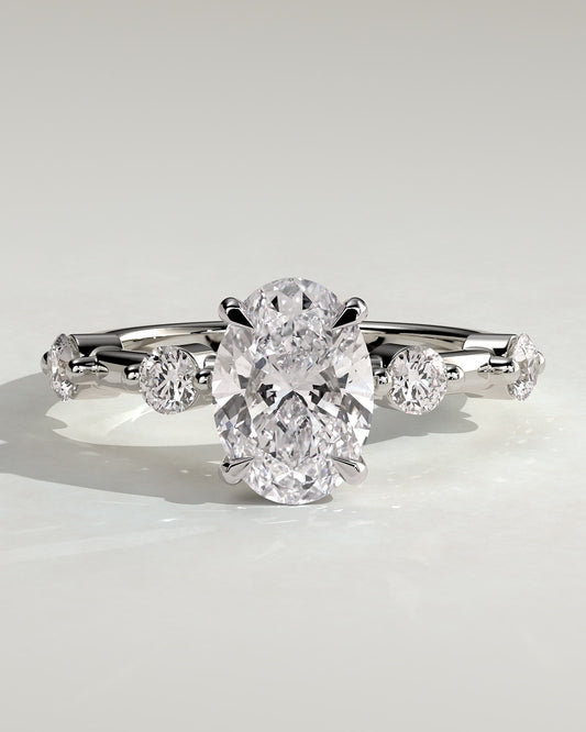 Arwen - Oval Claw Solitaire with 4 Spaced Round Accent Stones and Hidden Halo Engagement Ring - White Gold