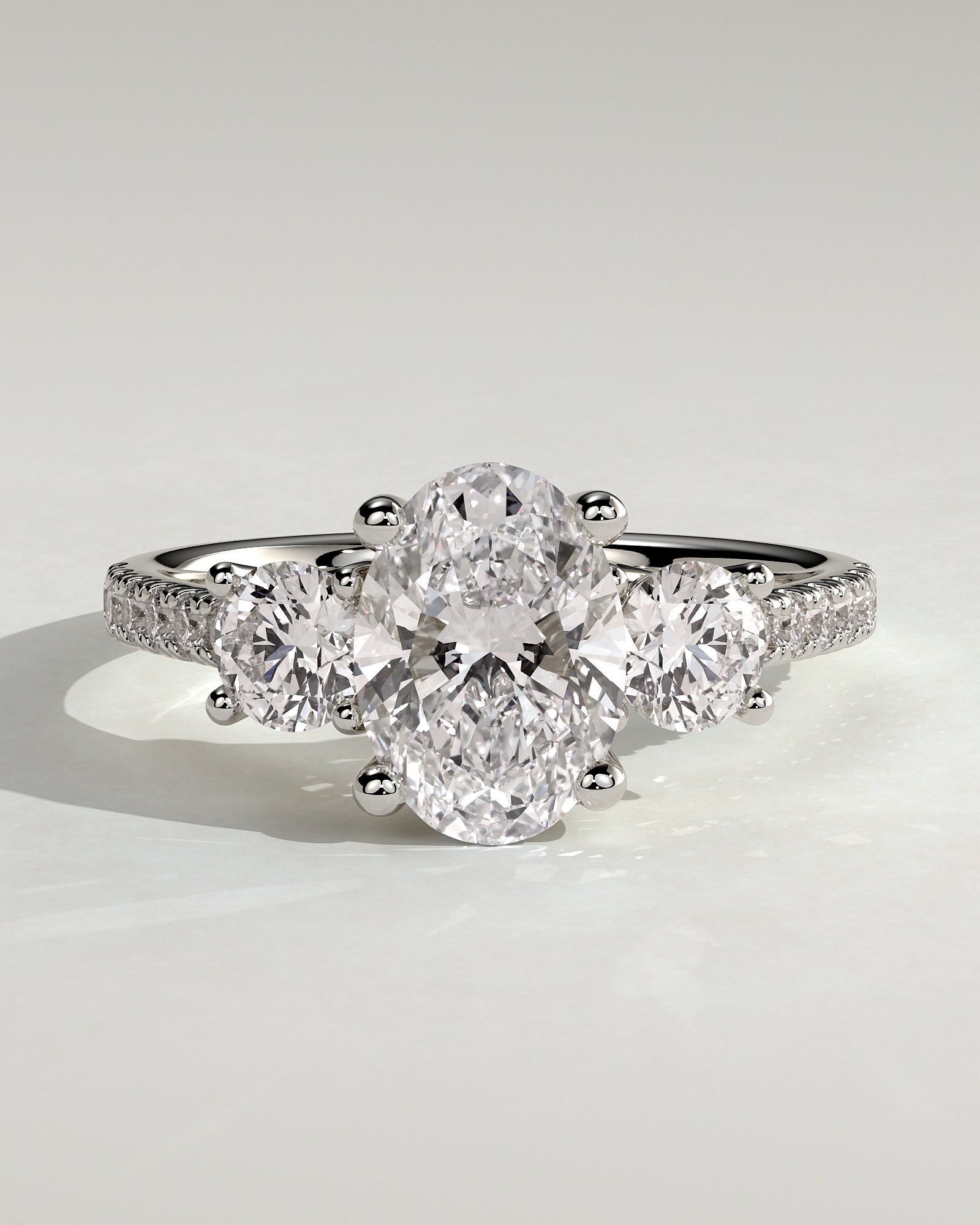 Aviana - Oval Claw Trilogy with Round Side Stones, Pave Band and Trellis Gallery  Engagement Ring - Platinum - White Gold / Platinum 2ct