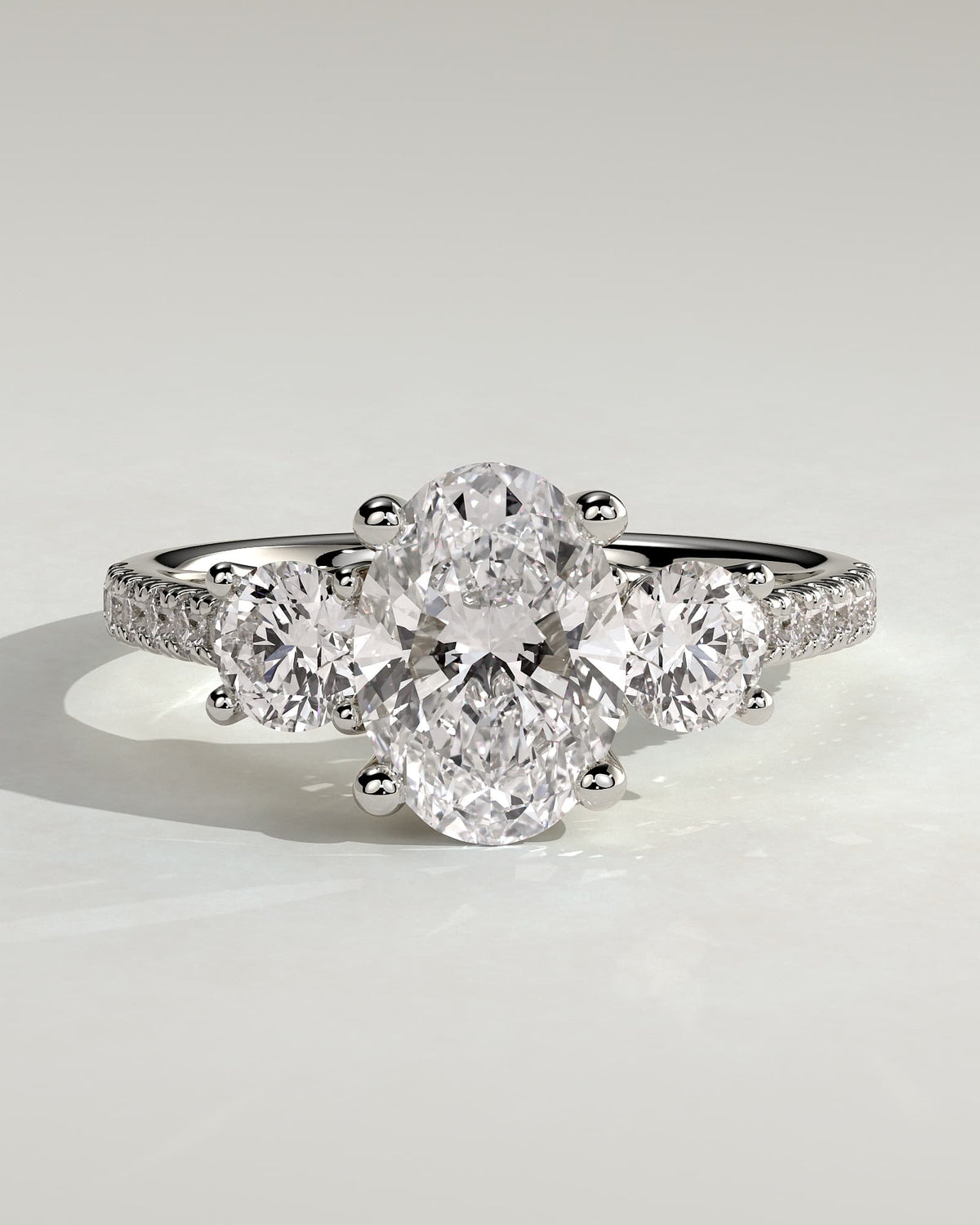 Aviana - Oval Claw Trilogy with Round Side Stones, Pave Band and Trellis Gallery  Engagement Ring - White Gold