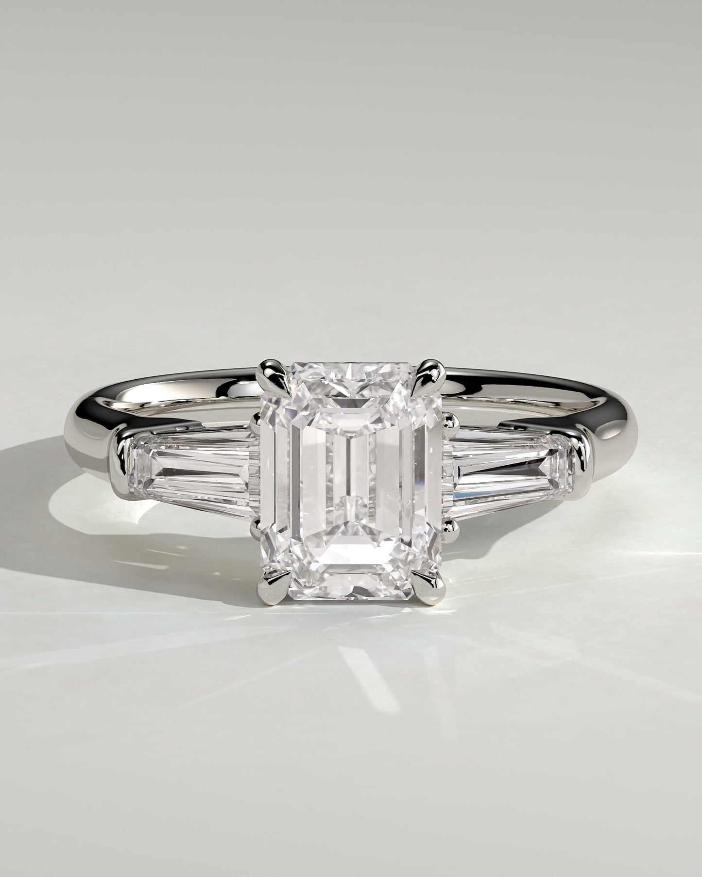 Bridget - Emerald Claw Trilogy with Tapered Baguette Side Stones and Cathedral Setting Engagement Ring - Platinum