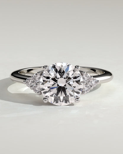 Greta - Round Claw Solitaire with Round Shoulder Stones Engagement Ring - White Gold