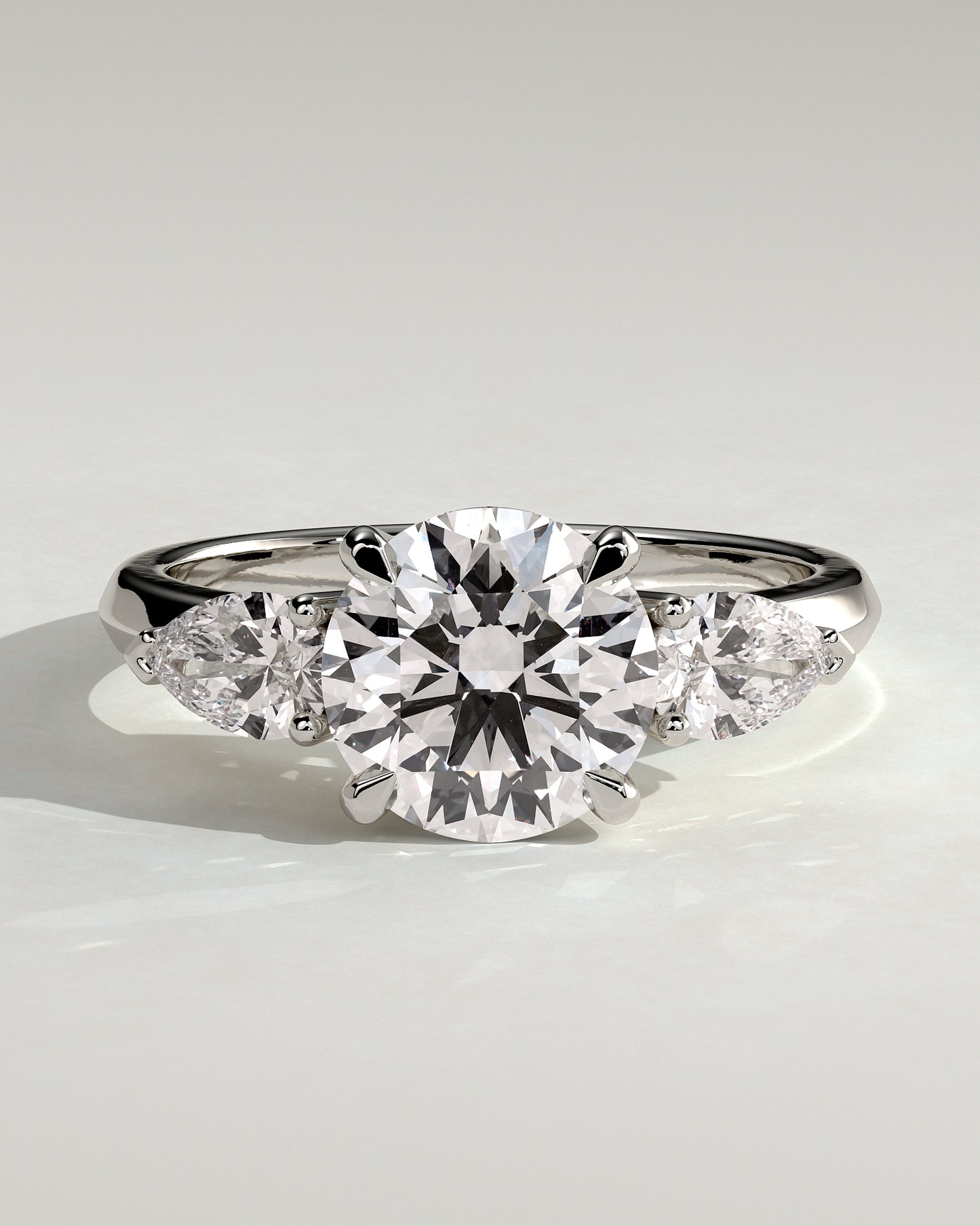 Halle - Round Claw Trilogy with Pear Side Stones and Knife Edge Band Engagement Ring - Platinum - White Gold / Platinum 2ct