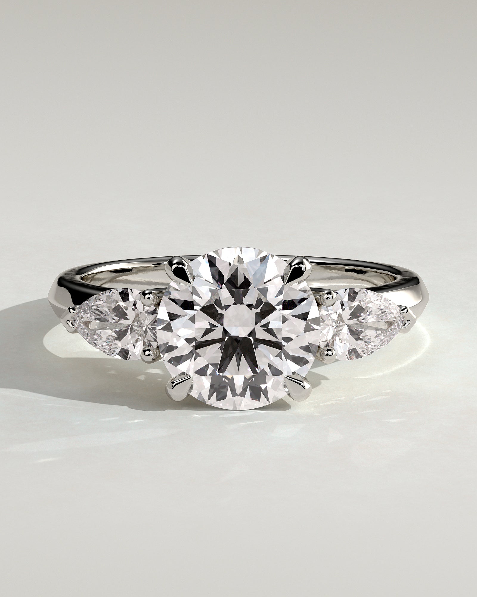 Halle - Round Claw Trilogy with Pear Side Stones and Knife Edge Band Engagement Ring - Platinum - White Gold / Platinum 2ct
