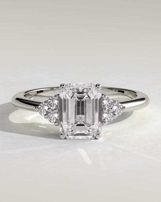 Martina - Emerald Claw Solitaire with Round Shoulder Stones Engagement Ring - Platinum
