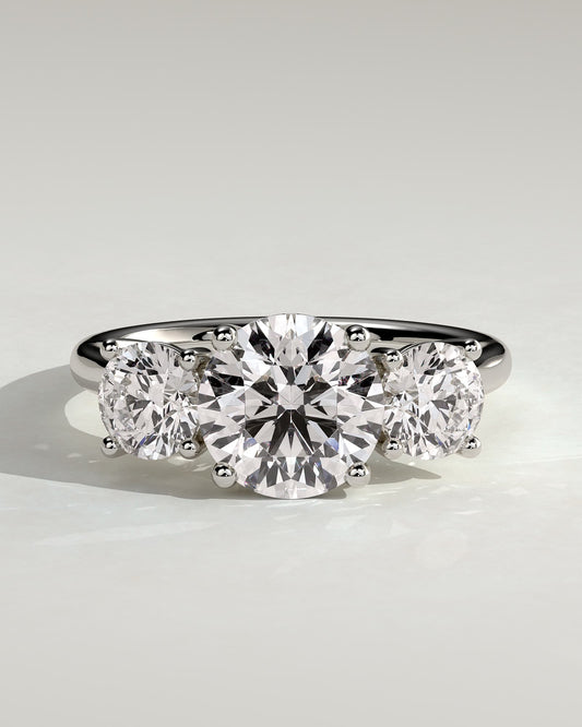Octavia - Round Claw Trilogy with Round Side Stones and Trellis Gallery Engagement Ring - White Gold