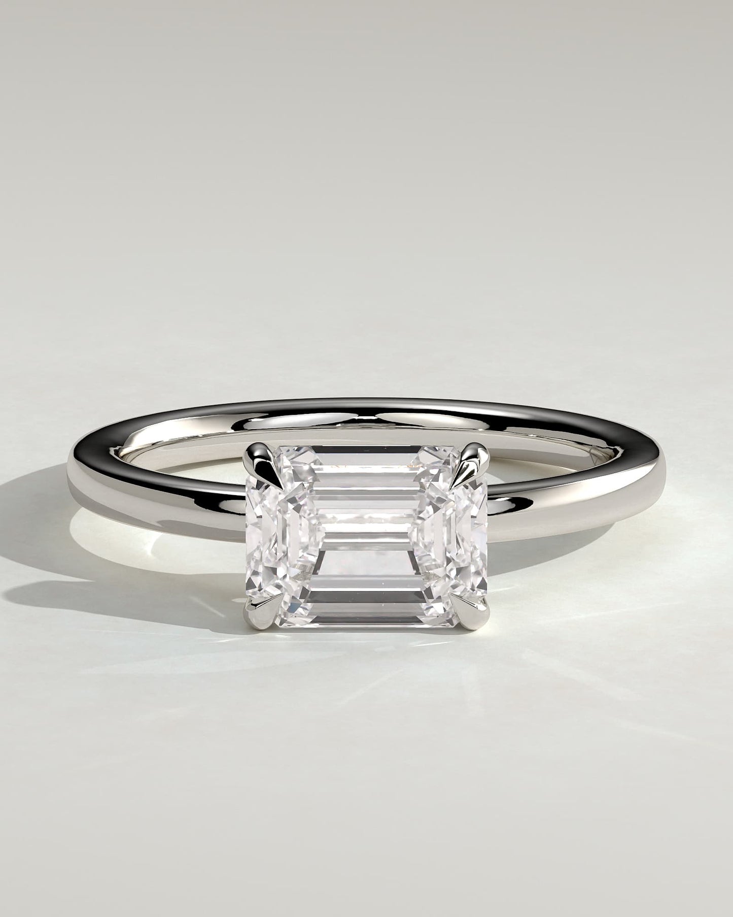 Evelyn - Emerald East West Claw Solitaire with Raised Basket Gallery Engagement Ring - White Gold