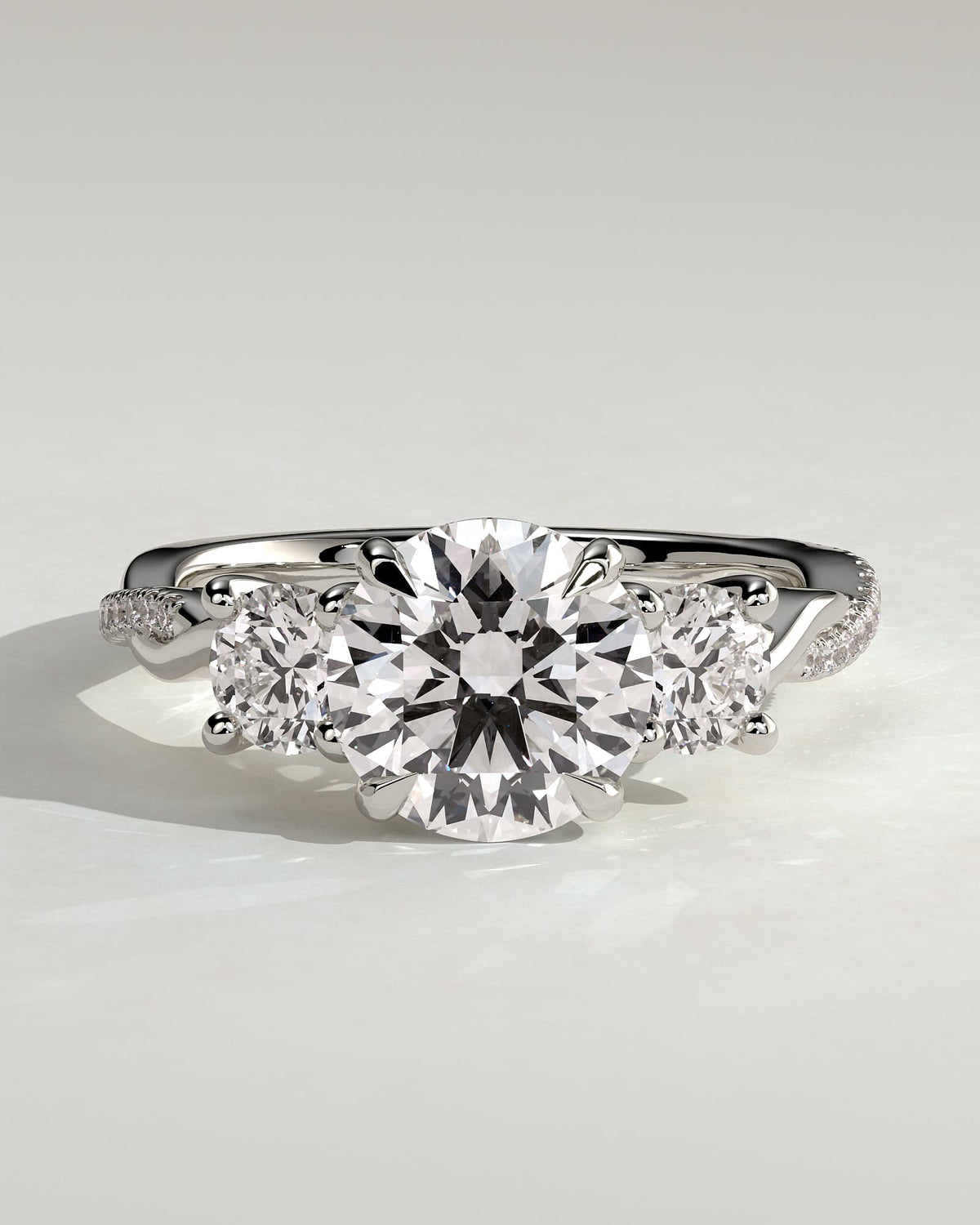 Jaylene - Round Claw Trilogy with Round Side Stones, Twisted Pave Band and Trellis Gallery Engagement Ring - Platinum