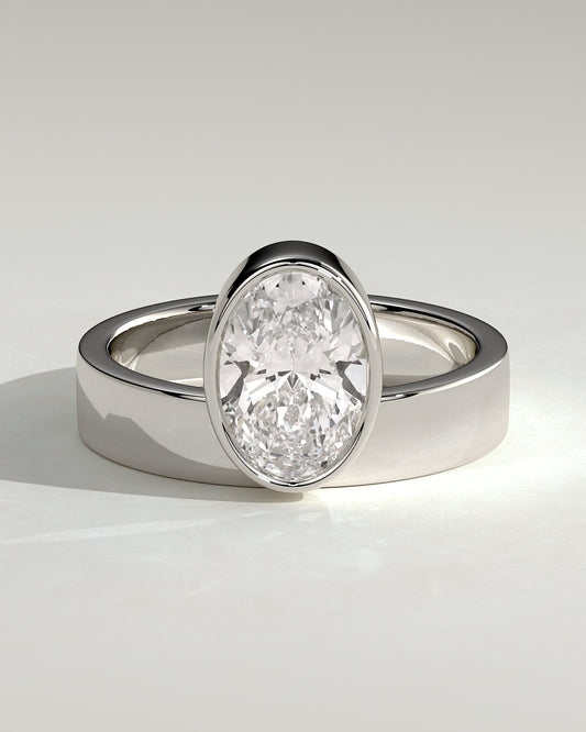 Carmen - Oval Bezel Solitaire with Offset Setting and Flat Cigar Band Engagement Ring - Platinum