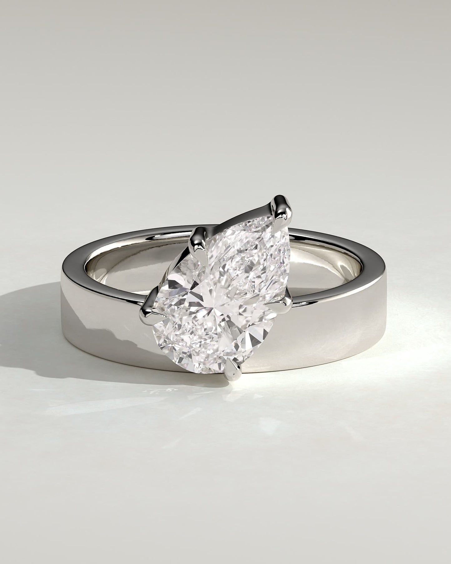 Tatiana - Pear Claw Solitaire with Offset Angled Setting and Flat Cigar Band Engagement Ring - Platinum