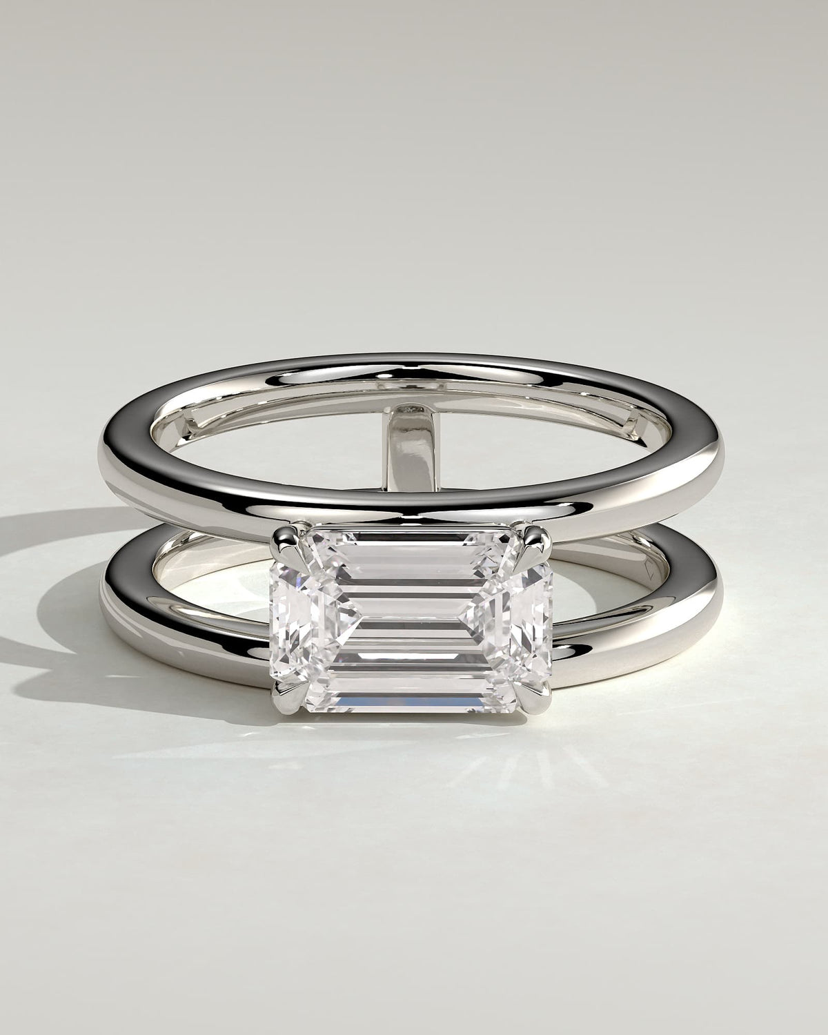 Devon - Emerald East West Claw Solitaire with Spaced Double Band Engagement Ring - White Gold