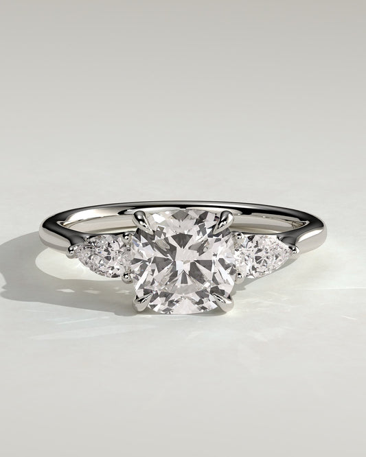 Selena - Cushion Claw Trilogy with Pear Side Stones and Open Trellis Gallery Engagement Ring - Platinum