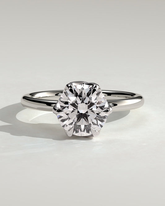 Rita - Round Claw Solitaire with Crossover Petal Gallery Engagement Ring - Platinum