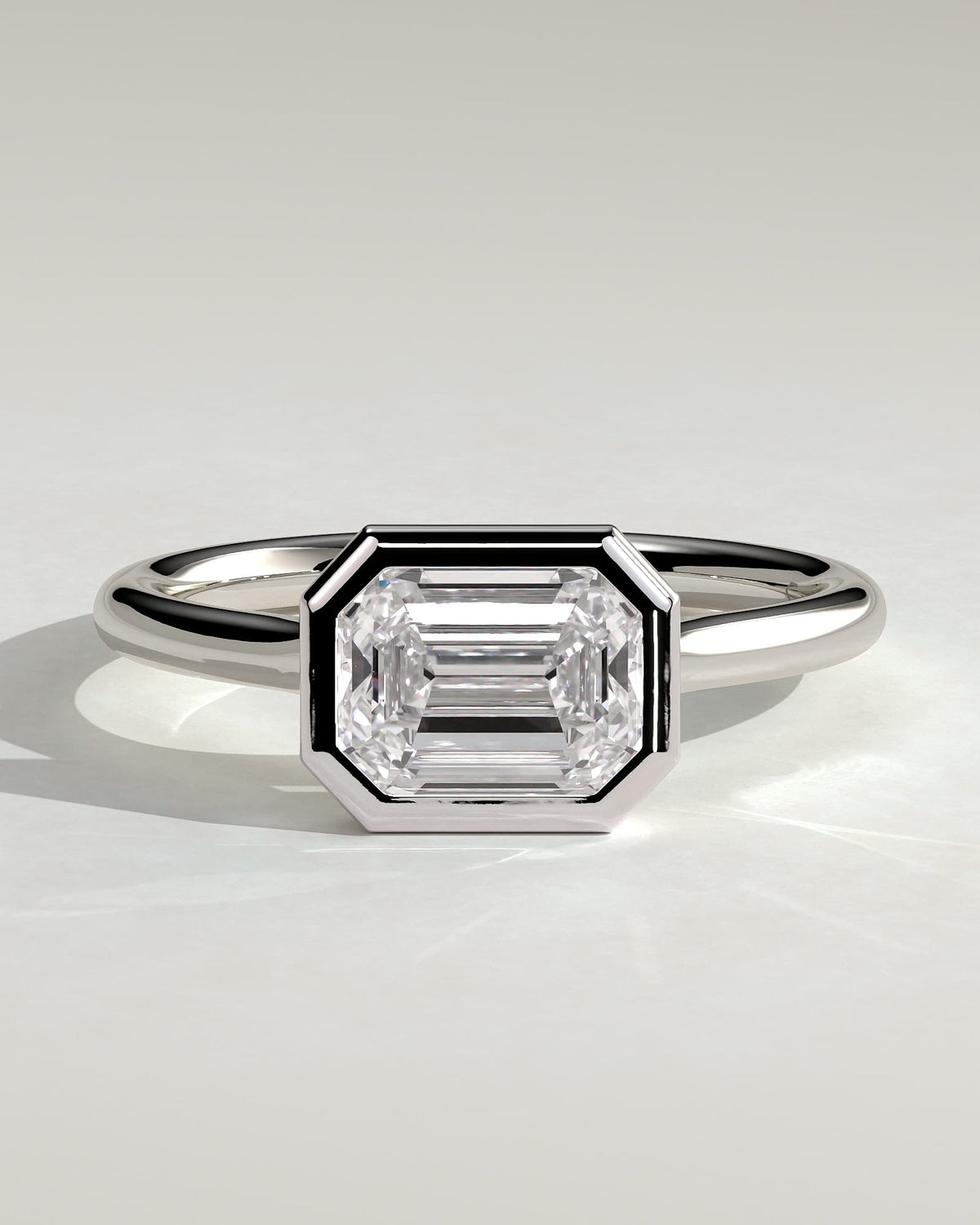 Olive - Statement Emerald East West Bezel Solitaire with Open Cathedral High Setting Engagement Ring - Platinum