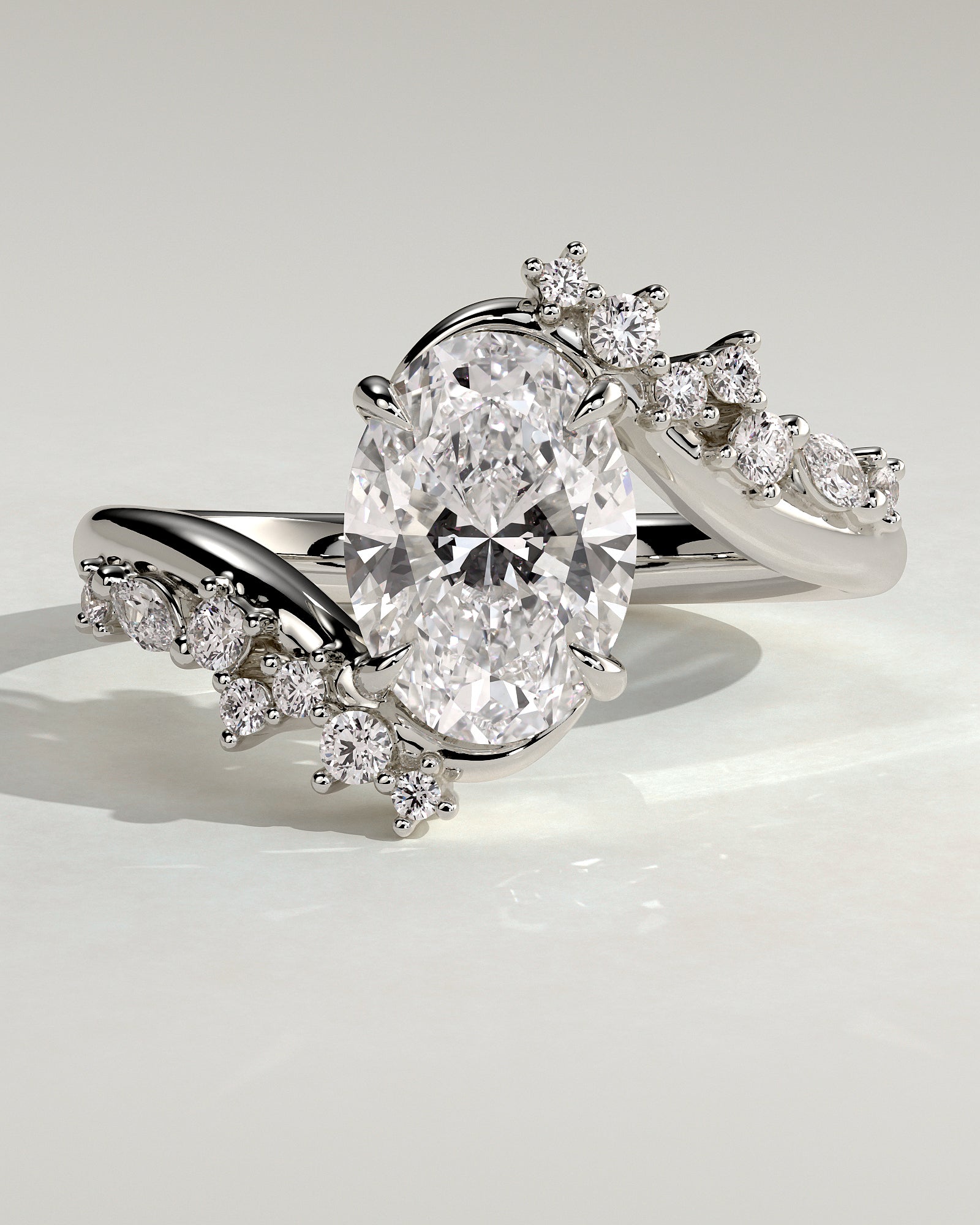 Ezmerelda - Oval Claw Solitaire with Bypass Band and Clustered Round-Marquise Accent Stones Engagement Ring - Platinum - White Gold / Platinum 2ct