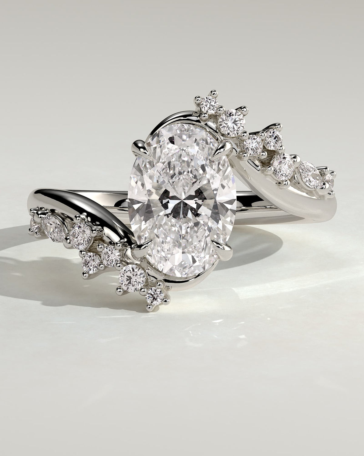 Ezmerelda - Oval Claw Solitaire with Bypass Band and Clustered Round-Marquise Accent Stones Engagement Ring - White Gold