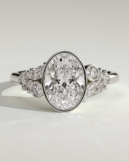 Isabella - Oval Bezel Solitaire with Clustered Round-Marquise Mixed Set Shoulder Stones Engagement Ring - Platinum