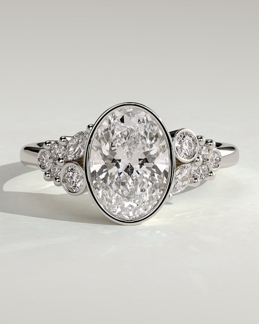 Isabella - Oval Bezel Solitaire with Clustered Round-Marquise Mixed Set Shoulder Stones Engagement Ring - Platinum