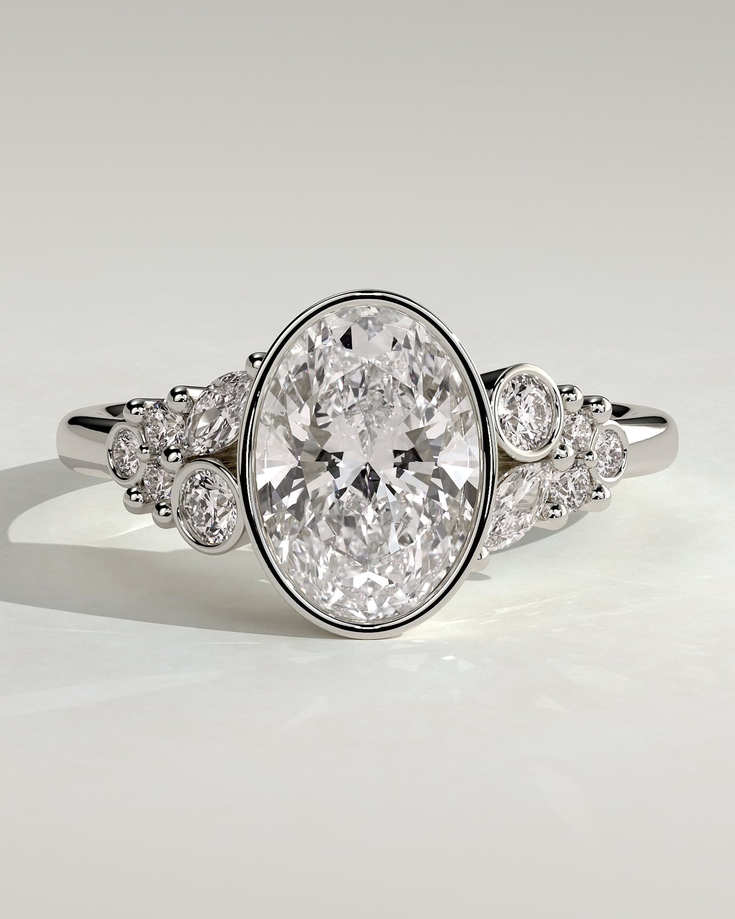 Isabella - Oval Bezel Solitaire with Clustered Round-Marquise Mixed Set Shoulder Stones Engagement Ring - White Gold