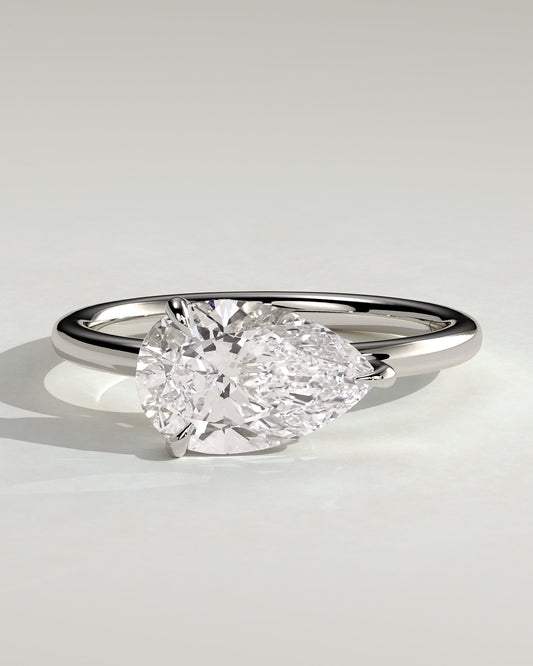 Suki - Pear East West Claw Solitaire with Raised Basket Gallery Engagement Ring - Platinum
